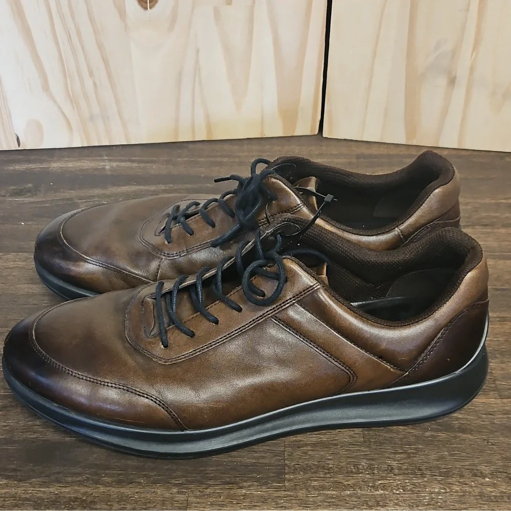 These are ECCO Aquet Men's Sneakers in a rich, dark brown leather finish.